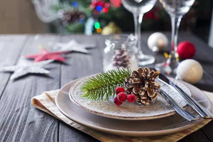 Table served for Christmas dinner in living room, close up view