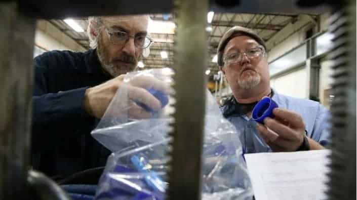 Tony Ward, left, and Bob Leadingham inspect parts in the tool room at Hoffer Plastics on May 13, 2019 in South Elgin. The custom injection molding company shifted suppliers from China to other countries, such as Vietnam, after the first round of tariffs last year. (Stacey Wescott/Chicago Tribune)
