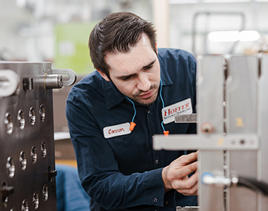 tool room mechanic working on mold